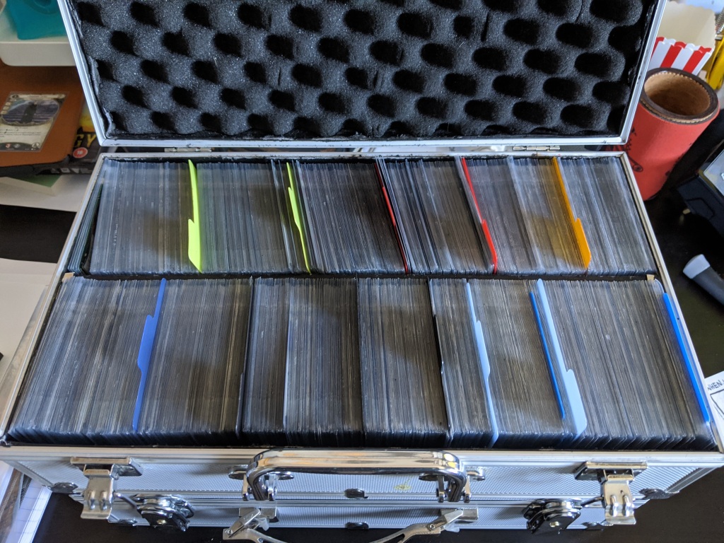 Investigator cards sleeved and in a metal carry case